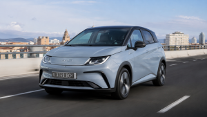 Affordable 2026 electric vehicle driving on a modern road